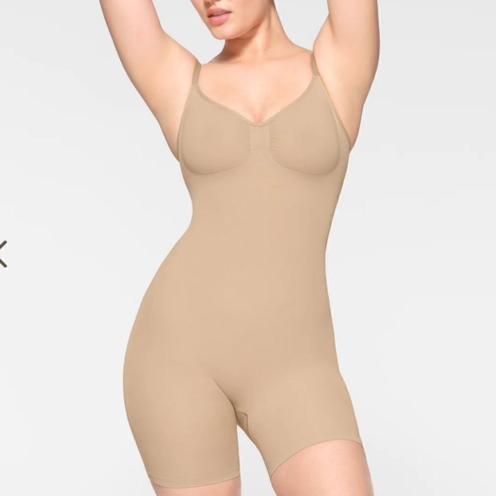 SKIMS Sculpting Seamless Shaping Mid Thigh Bodysuit In Clay Nude